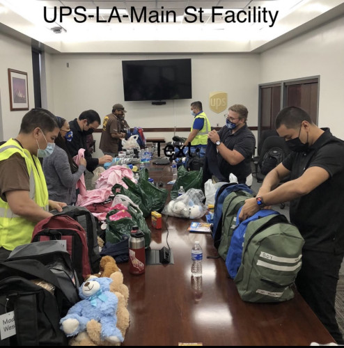 UPS staff assembling backpacks 