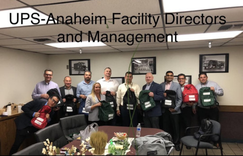 UPS Anaheim Facility-Directors and Managers assemble backpacks 